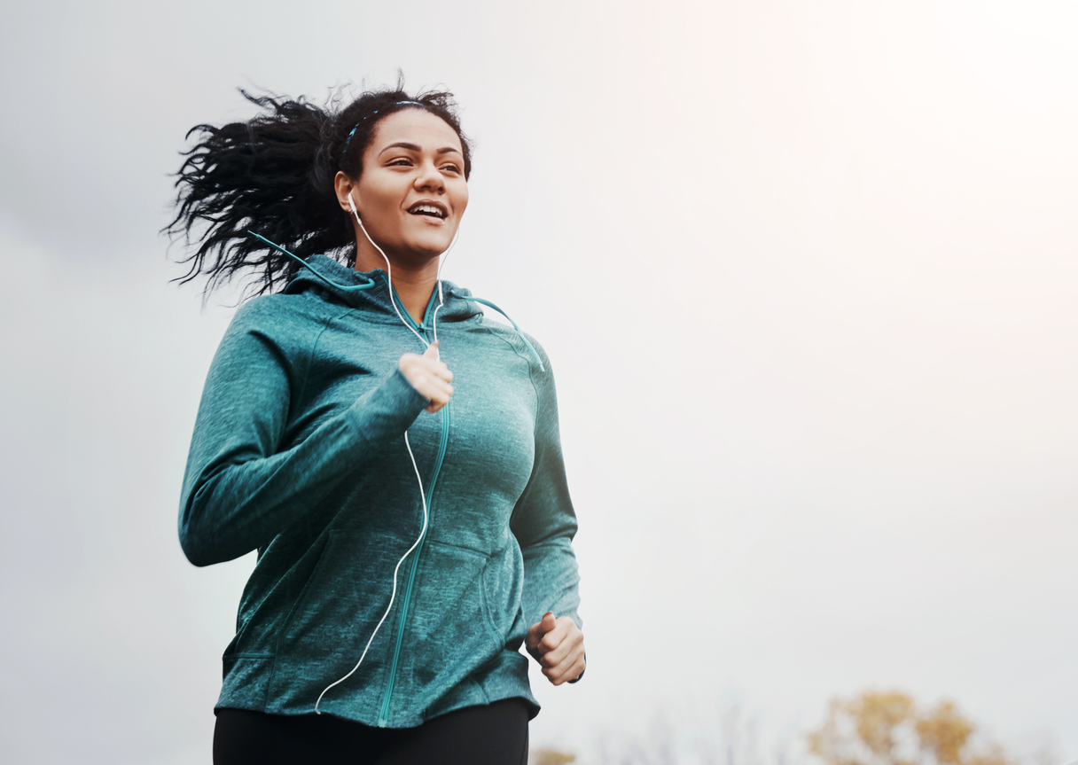 Music, Running And Woman Outdoor For Fitness, Jog And Healthy Body In Winter On Mockup Space. Earphones, Cardio And Person Exercise For Sport, Wellness Or Training For Marathon Race In Nature At Park